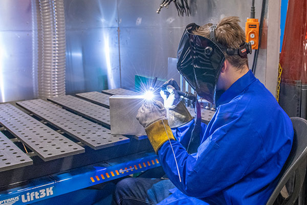 Welding creates a strong bond between two pieces of sheet metal.