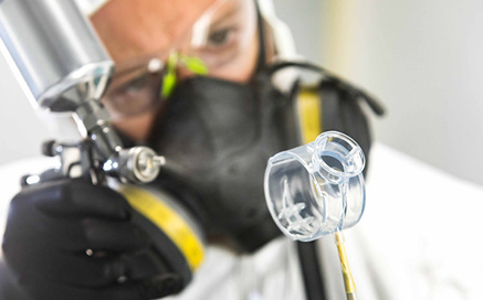 secondary ops technician painting 3D printed parts