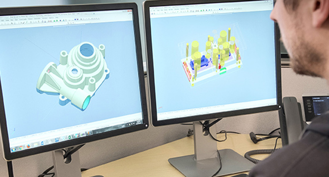 application engineer examining injection molding CAD file