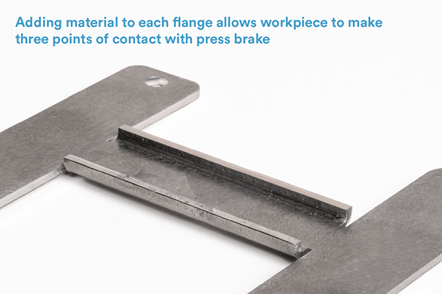 By adding material to a short flange, the workpiece makes three points of contact with the press brake.