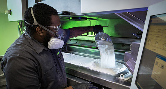 Black worker in mask using Nylon in 3D Printer