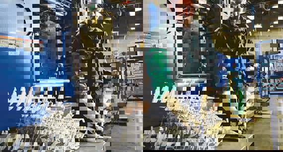 Technician removes gating material on magnesium parts