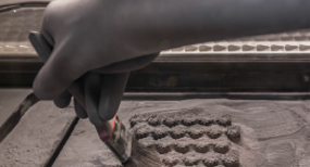 A bed of metal parts following a direct metal laser sintering build