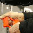 engineer stretches liquid silicone rubber part