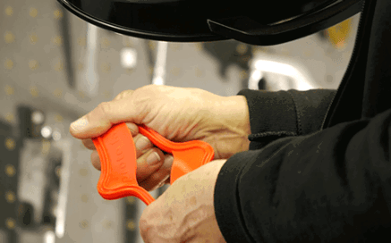 engineer stretches liquid silicone rubber part