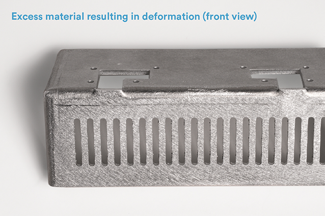 In images A and B (below), the bracket includes two L-shaped cutouts that end along the bend. The material is deformed at the point where the top of each L meets the bend.