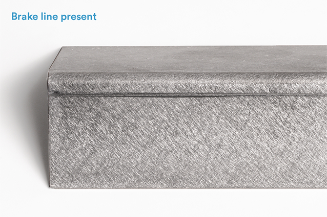 Bent sheet metal with press brake line present.