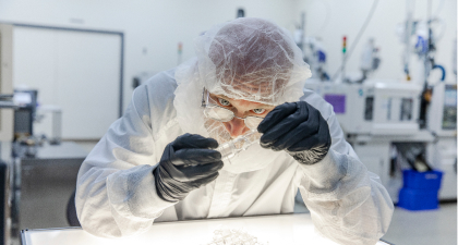 Clean room operator sterilizing parts