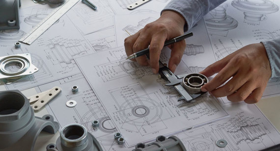 engineer designing product blueprints