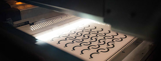 Black 3D printer extruder heads in a bottom-up view