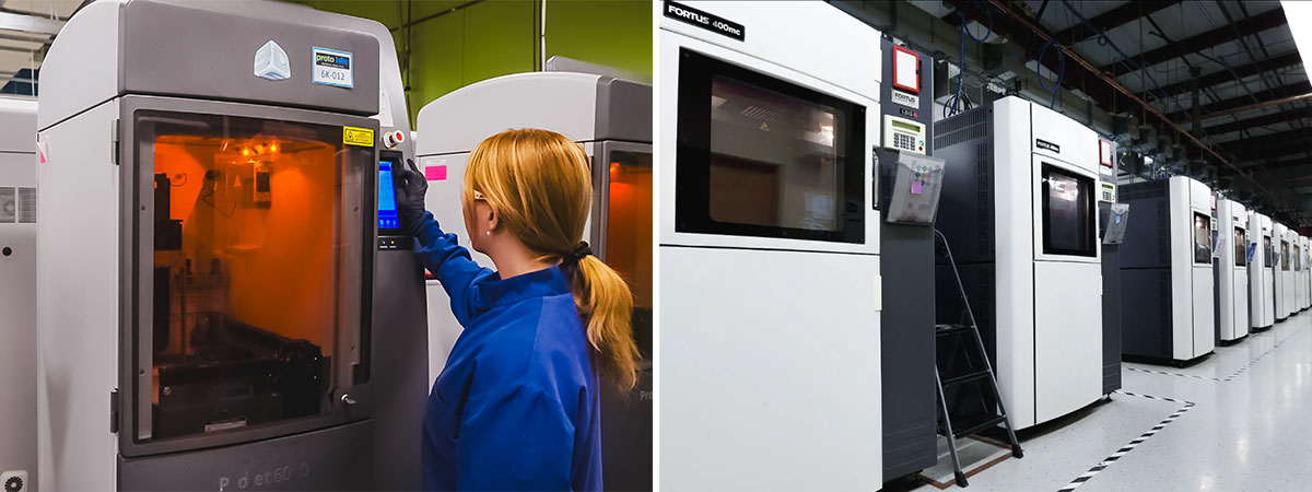 Technician operating a 3D printer and a row of industrial 3D printers in a factory.
