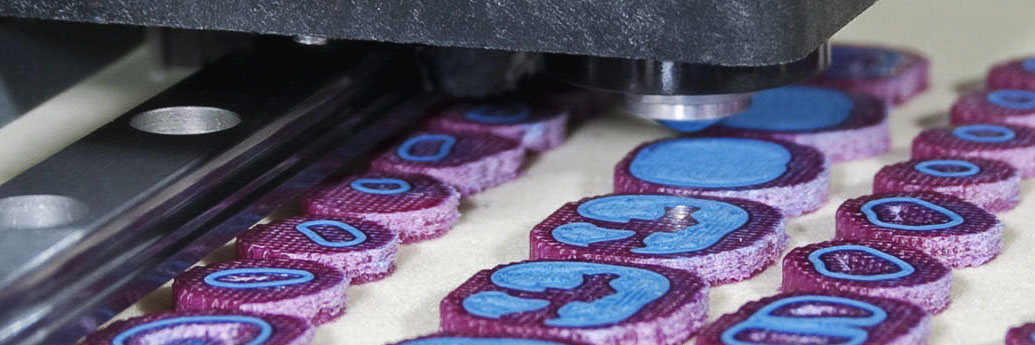 Drop demand printers print dissolvable support (purple) around the final wax parts used for investment casting (blue) (image courtesy of Solidscape)